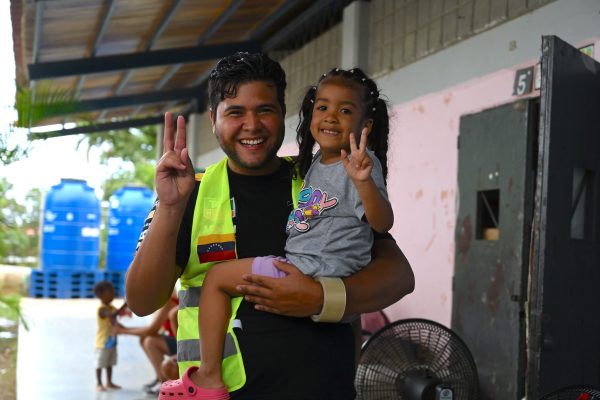 A local volunteer shares a moment with a child during GFoundation’s relief efforts in Venezuela.